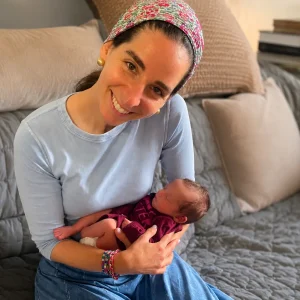 Judy Ribner holding a baby