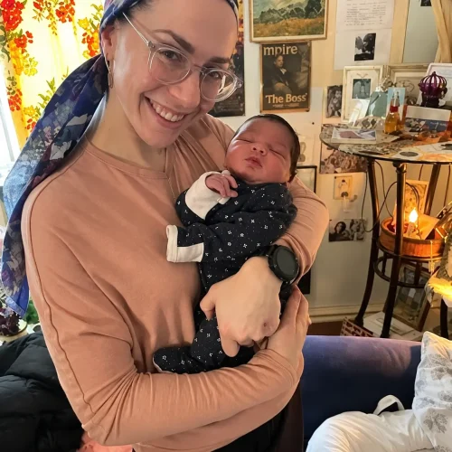 Malki holding a baby